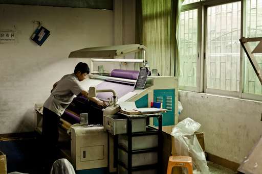 Worker at Lian Hing factory, which makes swimsuits and underwear