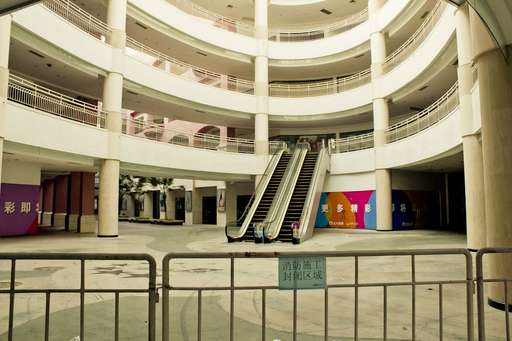 A shopping gallery at the mall lies empty 