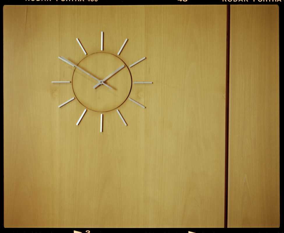 Wall-mounted clock in lobby