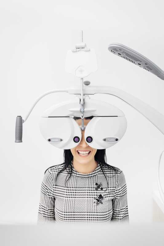 Staff member having her eyes examined