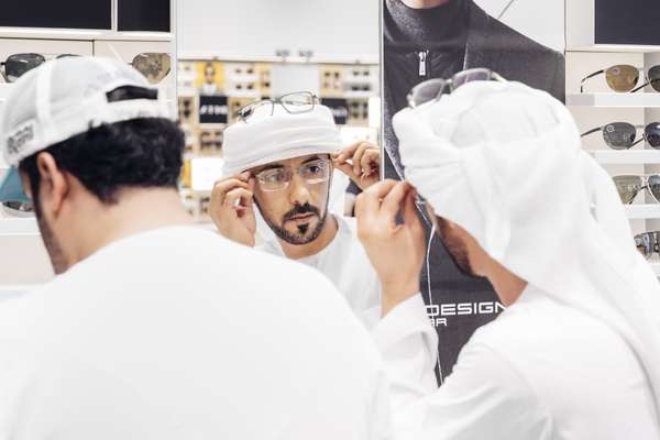 Trying on glasses at the Magrabi shop in Dubai’s City Walk mall 