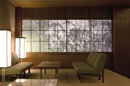 Bamboo silhouetted behind paper screens in the lobby