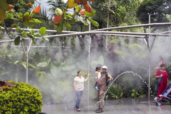 Families relax at the Parque Explora