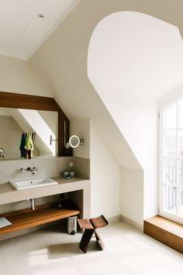 Sori Yanagi butterfly stool in a spacious bathroom