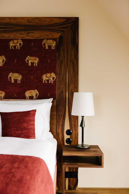 Headboard with signature elephant detail 