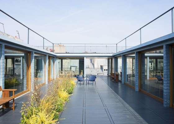 Mediterranean-style courtyard above the garage 