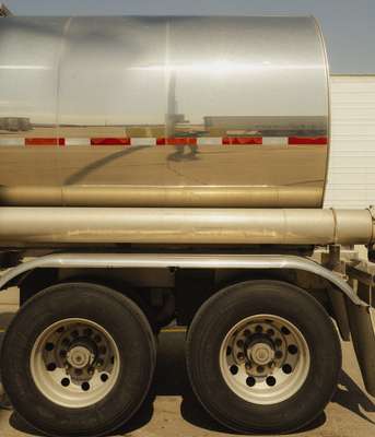 A truck reflecting the glaring sun as its driver takes a break