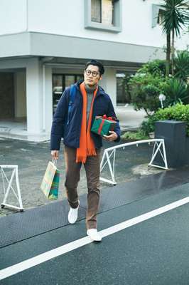 Down jacket by Prada, rollneck jumper by Massimo Alba, trousers by gta, trainers by Golden Goose Deluxe Brand, glasses by Lindberg, scarf by The Inoue Brothers from Wild Life Tailor, backpack by Herschel Supply ––