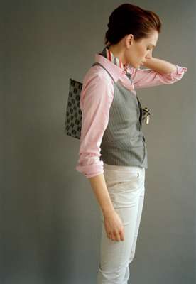 Shirt by Lauren By Ralph Lauren, scarf by Paul Smith, waistcoat by Paul Smith Black, trousers by Bamford,  bag by Loewe
