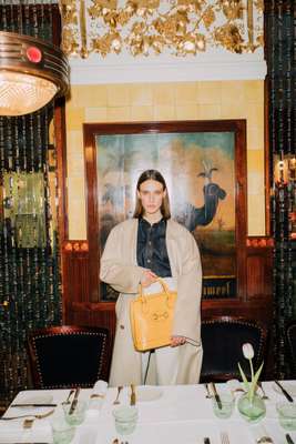 Coat and bag by Gucci, shirt by Bottega Veneta, trousers by Margaret Howell