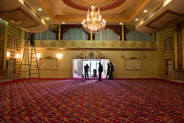 Housekeeping staff clean the ballroom, which holds up to 1,000 guests 