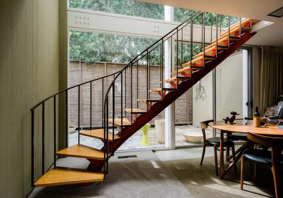 The bannister rail is fashioned from a single piece of bent metal