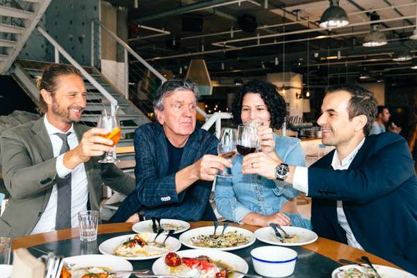 From l-r: Justin Hemmes, Terry Durack, Analiese Gregory and Peter Andrews clink glasses 