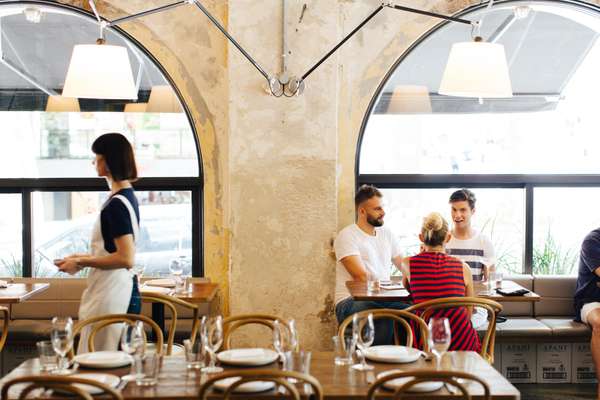 Artemide lamps and Thonet chairs make for  comfortable surroundings