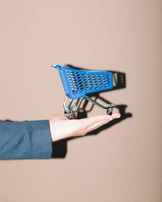 Miniature Wanzl trolley used as a desktop pen pot