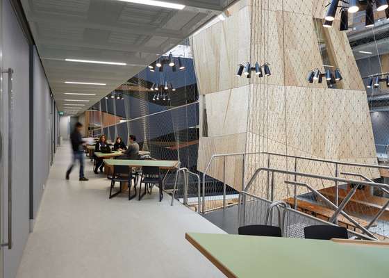 Second-level overlooking the atrium, with informal work areas running along the balconies where students can gather and collaborate