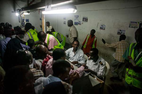 Airport staff check in passengers