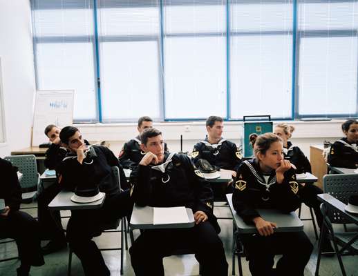 Naval academy students usually sit in class according to their grade