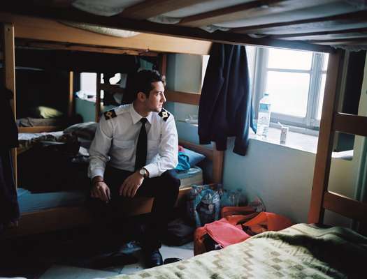 George Pandis, a student at Hydra's merchant marine academy, on his bunk bed