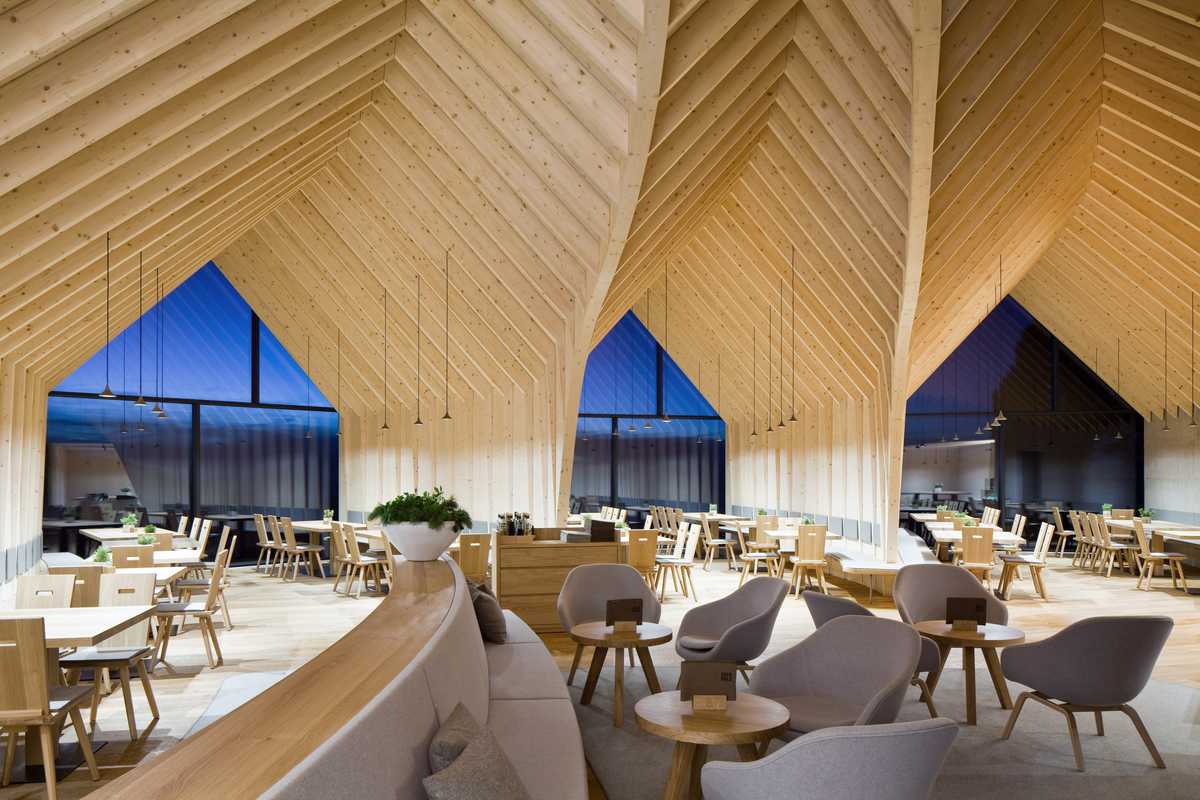 The interior is a complex curvilinear  wood structure 