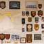 Squadron and regimental badges adorn a wall in the office of the EU mission commander 