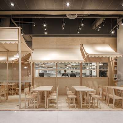 Monochrome interior of Eat that look like it's made entirely from balsa wood