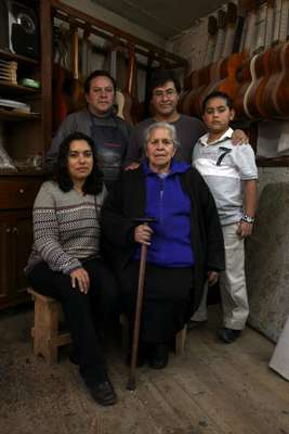 García (centre, back row) with the family – his brother (to his right), son, wife Veronica (left, front row) and mother
