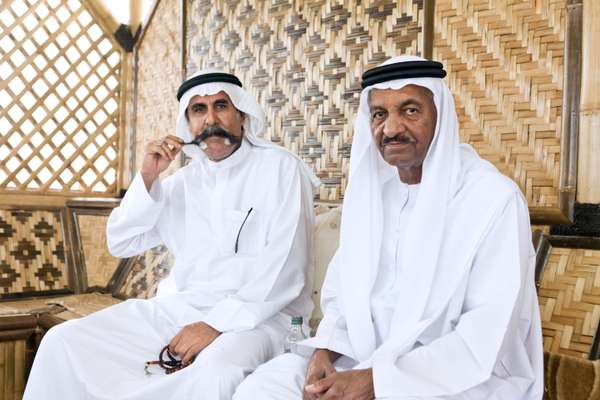 Halkl Mohamed, 55, and Hatim Jasim Salem, 65, inside a hut at the corniche in Fujairah