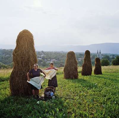 Alfalfa stacks standing sentinel on the hillside outside Breb