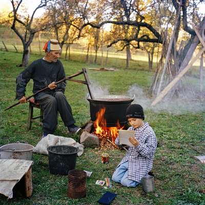 Cooking plum jam in the autumn