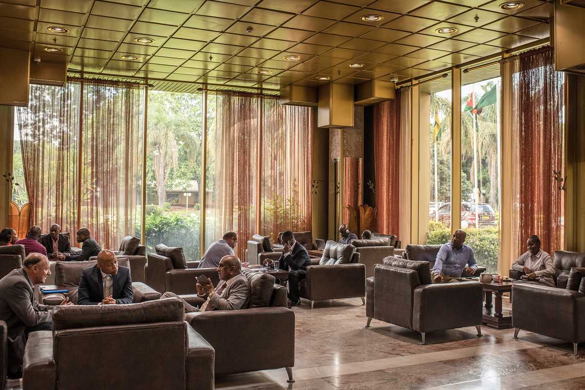 Business meetings in the lobby of the Rainbow Towers Hotel in Harare