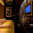 The six-person Room A is dominated by a huge gold vinyl daybed and padded walls with a private champagne bar and karaoke plasma screen along one side 