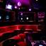 Seating 24 people, Amour’s Room C features red velvet tables, a DJ booth and a glass stage surrounded by mirrors