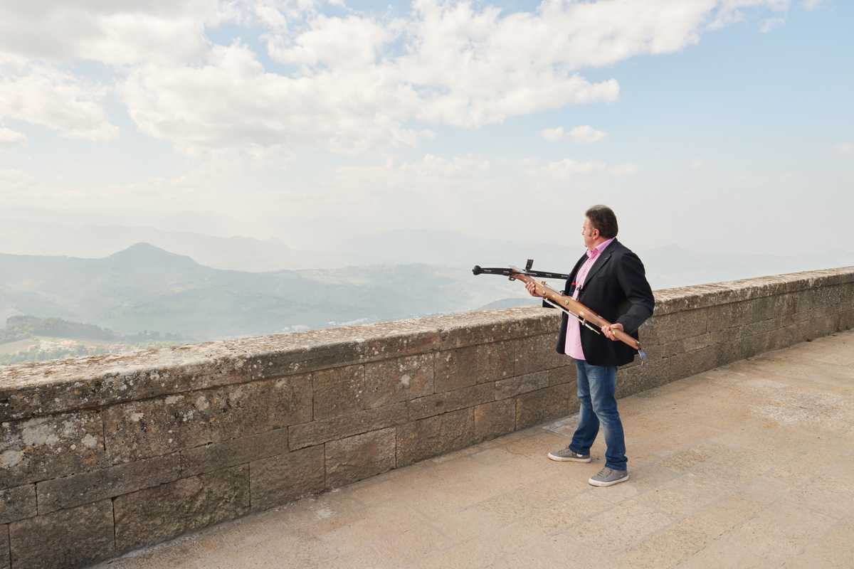 Stefano Ugolini, chairman of the Crossbow Corps, takes aim