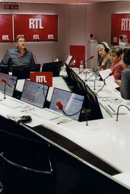 Yves Calvi, RTL morning host, and his team