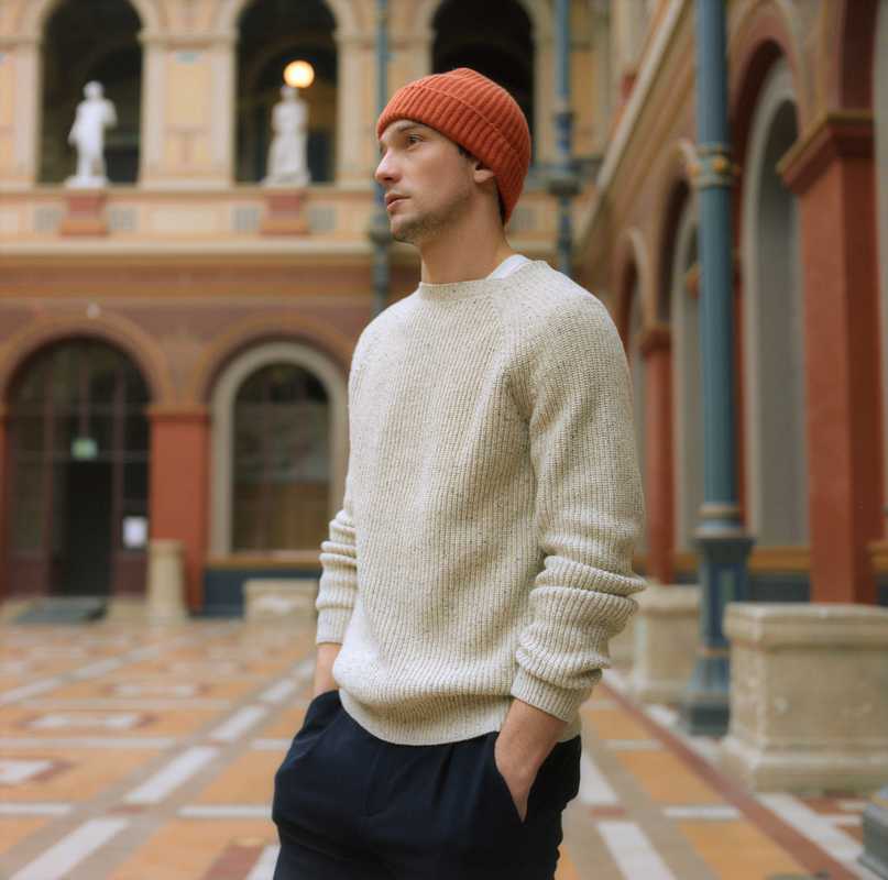 Jumper by APC, T-shirt by Calida, trousers by Circolo 1901, beanie by Begg & Co