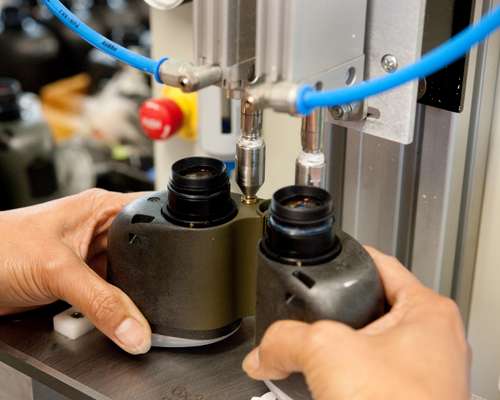 Dried nitrogen is blown into a pair of binoculars