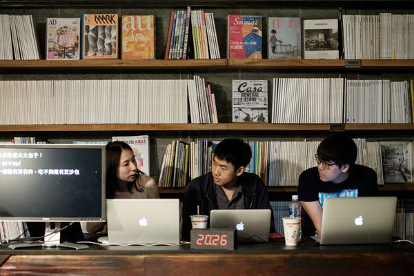 The research and policy team in the magazine library prior to filming 