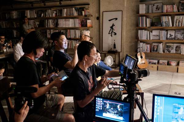 Producer Johnason Lo and crew getting the set ready for action