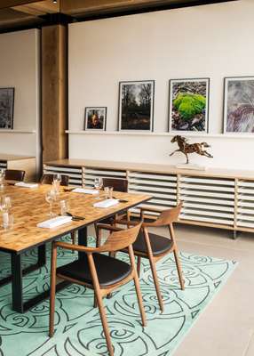 Rooftop meeting room features furniture from Maruni in walnut and leather