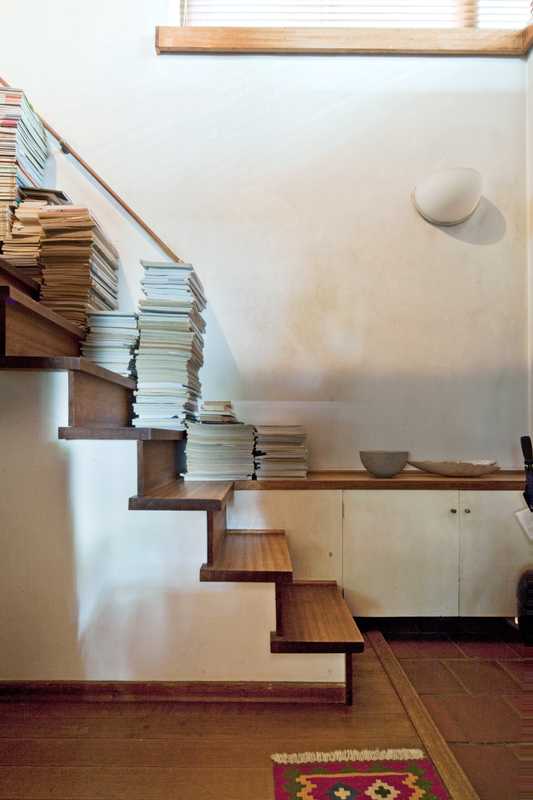 Staircase piled high with books and journals