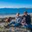 Producers Alice Laing and Chris Manson with daughter Flora and dog Beauly in Great Oyster Bay in Tasmania