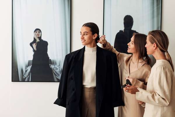 Pia Nordskaug (centre) and Celine Aagaard dressing a model