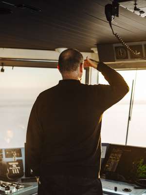 A deck officer surveying the horizon 