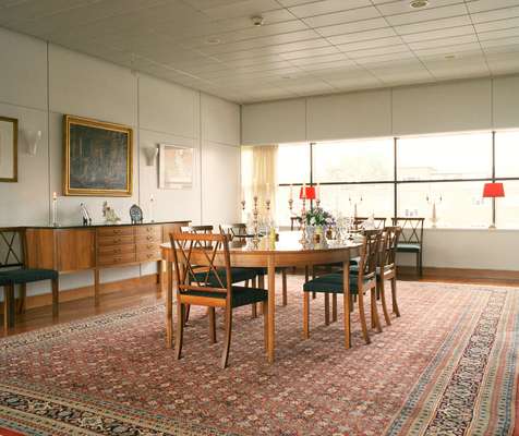 Dining room with oval table that extends to seat 24 people