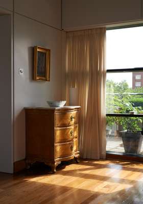 Antique pieces, such as this chest of drawers, rub shoulders with 20th-century designs