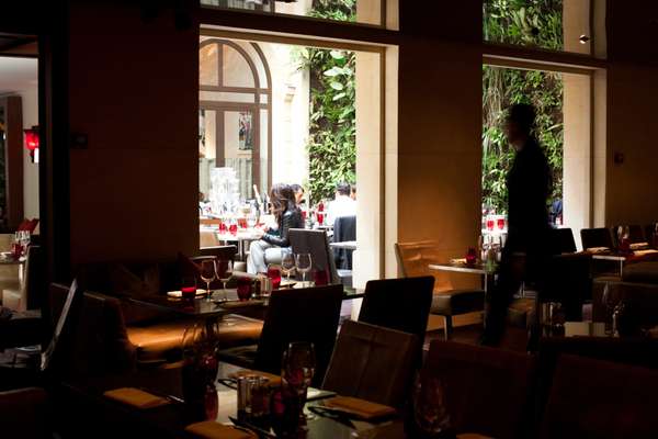 Pershing Hall’s restaurant has intimate spaces as well as an airy atrium