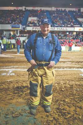 A fireman on hand at the tractor pull event