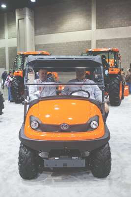 Kubota salesmen relax in one of the new RTVs