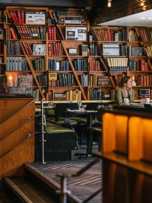 Books and vintage radios line the dining room walls